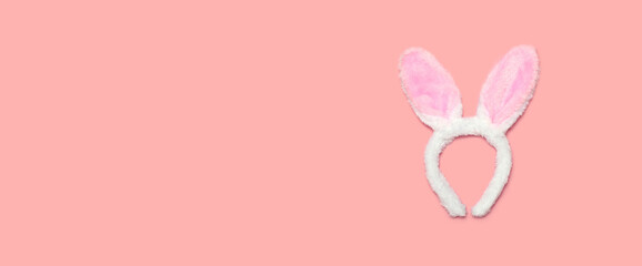 Sweet fluffy bunny ears isolated on pink background, top view, blank copy space for advertising text