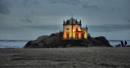 Chapel of Senhor da Pedra at nightfall in Miramar, Portugal