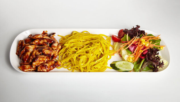 Grilled Chicken with Barbecue Sauce Linguine Pasta and Green Salad White Background
