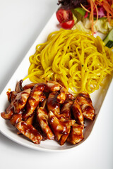Grilled Chicken with Barbecue Sauce Linguine Pasta and Green Salad White Background