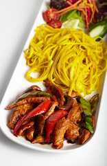 Grilled Chicken with Soy Sauce Linguine Pasta and Green Salad White Background