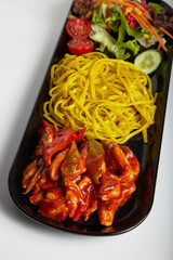 Grilled Chicken Linguine Pasta with Hot Sauce and Green Salad White Background