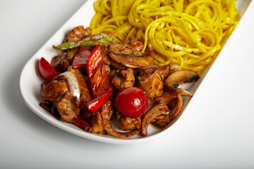 Grilled Chicken with Mexican Sauce with Linguine on White Plate Close Up