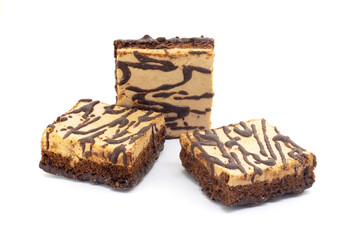 Cake pieces with chocolate icing on a white isolated background
