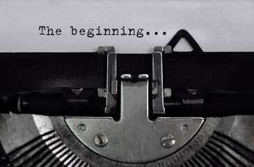 Text The beginning typed on retro typewriter