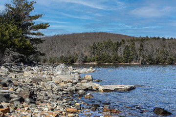 the rocky shoreline  of the quabbin reservoir