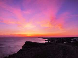 Beautiful colorful sunset at the montains at the sea