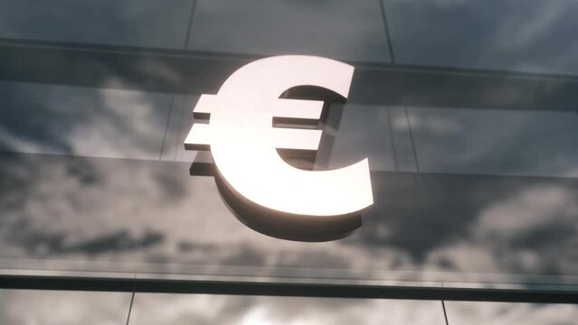 Euro EU currency sign on a modern glass skyscraper. Business and finance concept