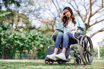 Fototapeta na wymiar sad woman sit on wheelchair after accident, insurance concept..