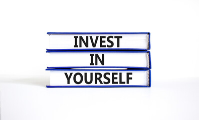 Invest in yourself symbol. Concept words Invest in yourself on books on a beautiful white table white background. Business and Invest in yourself concept. Copy space.