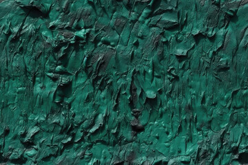 Texture Dark green uneven blue. Old wall painted with plaster. Teal color. Grunge surface background for design. Rough brush strokes. Tiled texture for graphic design background.