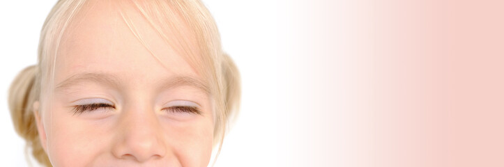Obraz premium close up part human eyes of little child 3 years old, blonde girl looking, eyes narrowed with laughter, concept of surveillance, vision examination, learns to wink, treatment of ophthalmic diseases