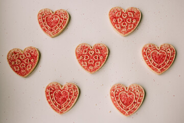 Heart cookie flat lay with bright sprinkles