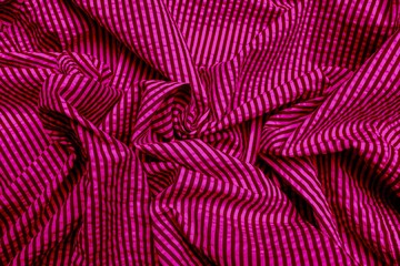 Silk Fabric Background, Abstract Flowing Waving Textile.Pink striped fabric.