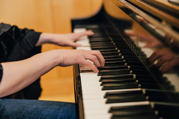 Fototapeta premium child playing piano