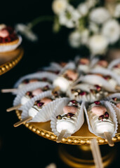 Candy bar at a party. Sweet buffet table with mini ice cream pops.