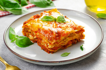 Delicious Homemade Lasagna with Bolognese Sauce on Bright Background, Italian Cuisine, Tasty Baked Lasagna