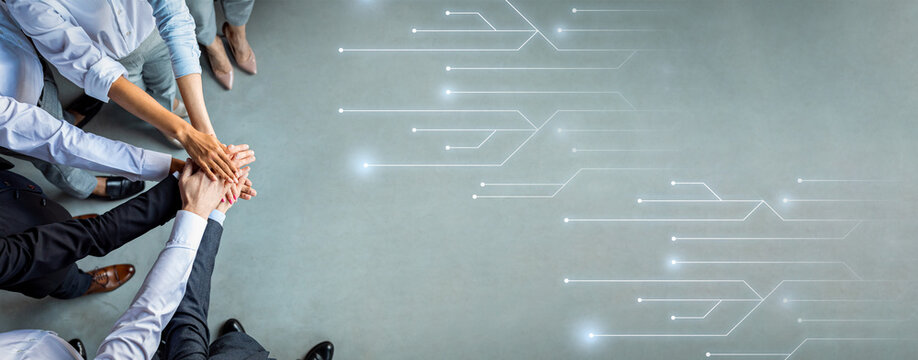 Multiracial people managers stack hands motivated for shared business success on gray background with lines