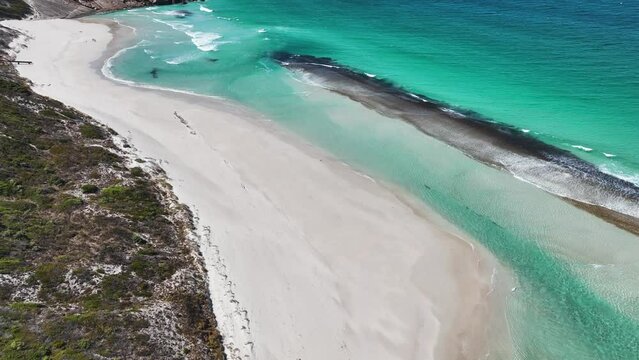Aerial view of waves rolling on the shoreline at West Beach, Western Australia, Australia.