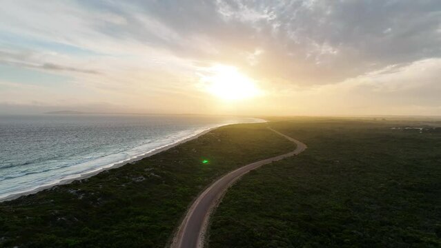 Aerial view of Wylie Bay, a long coastline at sunset, Western Australia, Australia.