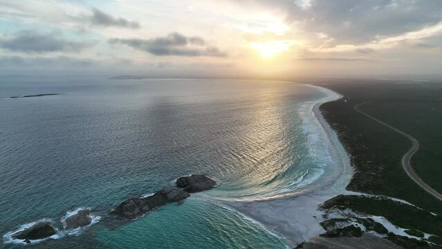 Aerial view of Wylie Bay, a long coastline at sunset, Western Australia, Australia.