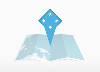 Micronesia is depicted on a folded paper map and pinned location marker with flag of Micronesia.