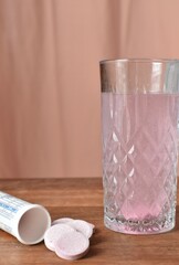 effervescent vitamins in a glass of water