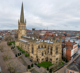 Obraz premium Wakefield, West Yorkshire, England, April 2nd 2023. Wakefield City Centre West Yorkshire. Aerial view of the Northern English city of Wakefield showing the Cathedral, residential and retail spaces