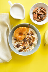 Oat porridge with caramelized pear and chocolate pieces