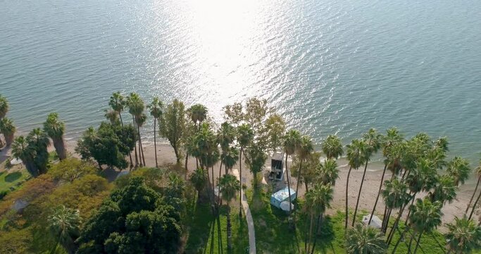Aerial view of a beach with palms by the lake, Sea of Galilee, Israel.