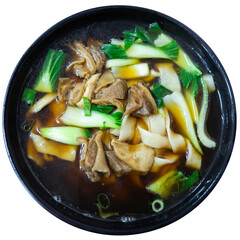 Appetizing ramen, noodle soup with tender beef pieces, mushrooms and greens served in meat broth. Traditional Chinese cuisine. Isolated over white background