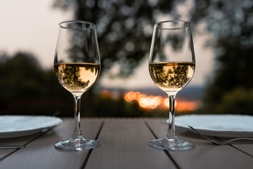 Romantic dinner restaurant setting and city sunset view  