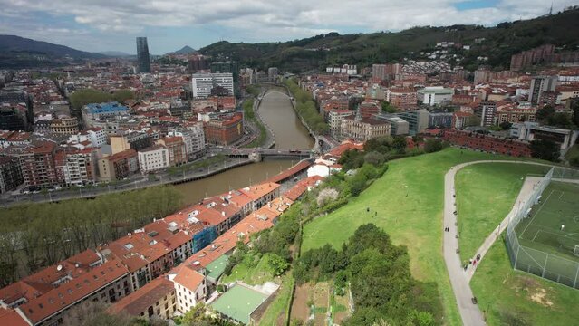 Aerial drone reveal of Bilbao, Basque Country, Spain above Etxebarria Park