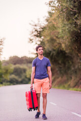 indian south asian middle aged man walk with suitcase on the road. insurance and divorce concept