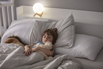 Little boy sleeping in bed. In the morning, the toddler sleeps in his room. Lifestyle.
A child's healthy sleep. 
