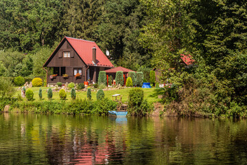 Fototapeta na wymiar Rural cabins near Luznice river, Czech Republic
