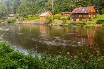 Fototapeta na wymiar Rural holiday cabins along Luznice river, Czech Republic