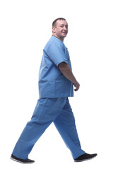 confident male doctor striding forward. isolated on a white background.