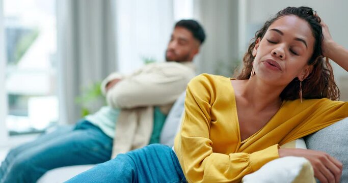 Stress, argument and conflict, couple on couch fighting about marriage crisis, debt anger and infidelity. Drama, angry woman and sad man in apartment with frustrated breakup, divorce and life problem