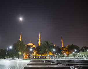 Fototapeta na wymiar Night evening view of the Sultanahmet Blue Mosque with minarets in Istanbul, a mosque with evening illumination