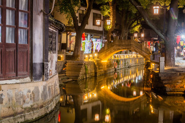 Fototapeta na wymiar LUZHI, CHINA - OCTOBER 27, 2019: Evening view of a canal in Luzhi water town, Jiangsu province, China