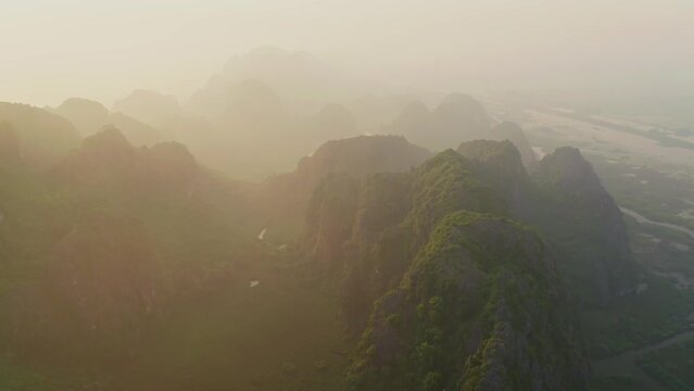 Aerial view of Khu Bao Ton hilly landscape at sunset, Gia Vien, Vietnam.
