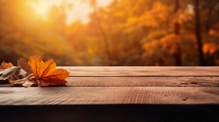 Naklejka na ściany i meble A wood table, a golden autumn sunset sky and leaf background for seasonal, autumnal thanksgiving images