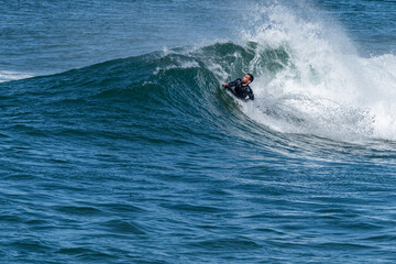 Bodyboarder surfing ocean wave