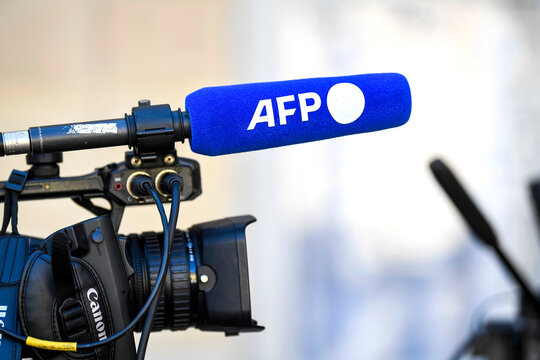 Illustration picture shows a TV television camera and a microphone with the logo of the French press agency "AFP" ("Agence France-Presse") at the Hotel Matignon, on April 4, 2023 in Paris, France.