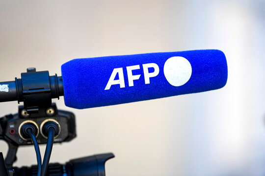 Illustration picture shows a TV television camera and a microphone with the logo of the French press agency "AFP" ("Agence France-Presse") at the Hotel Matignon, on April 4, 2023 in Paris, France.