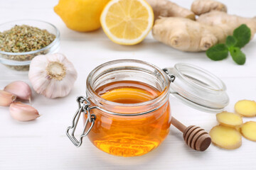 Different natural cold remedies on white table. Cough treatment