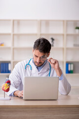 Young male doctor in telemedicine concept