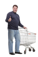 in full growth. casual mature man with shopping cart .