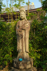 Tokyo, Japan - March 9, 2023: Statue of Kannon at Zojoji Temple is a Buddhist temple in Minato, Tokyo, Japan.